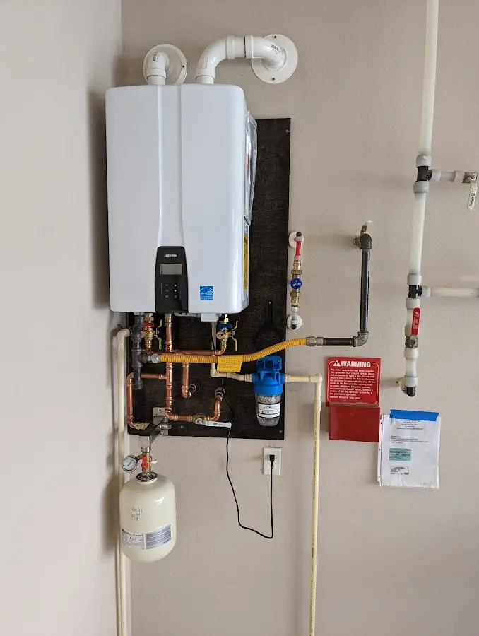 Professional plumber installing copper piping in a East Whiteland home